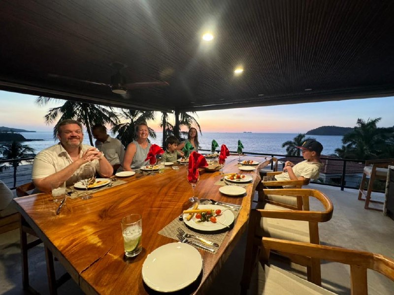 Dinner at the massive table on the deck with sunset views