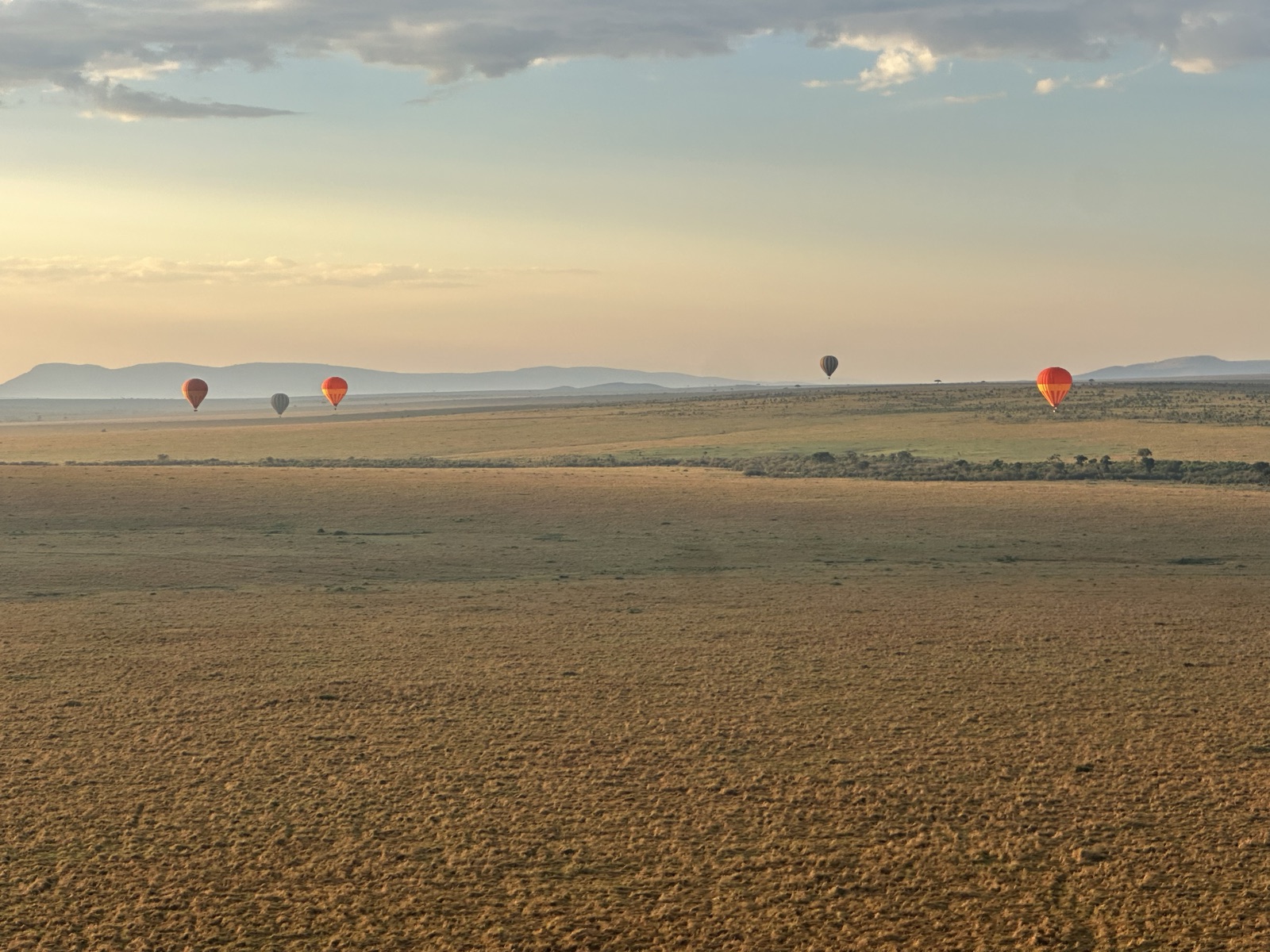 Other balloons drifting low over the Mara