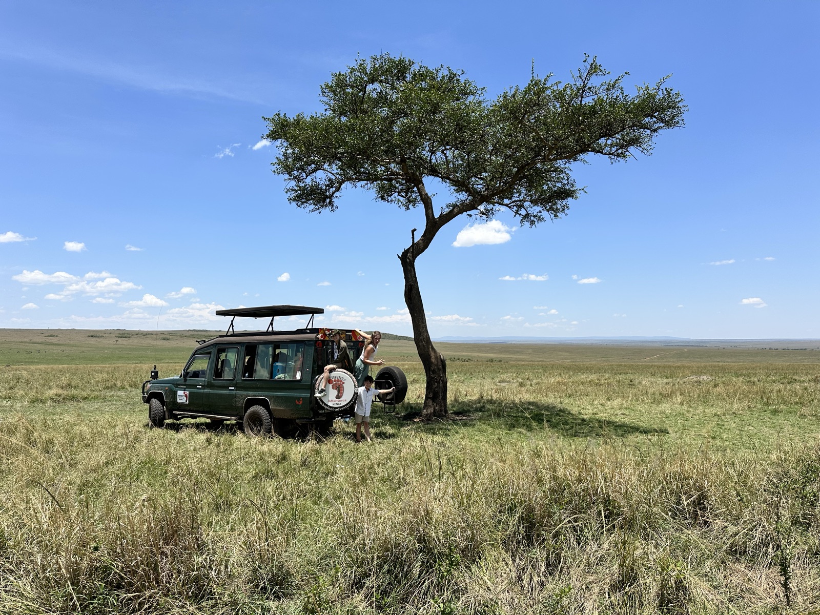 Our Land Cruiser under an acacia in the Mara